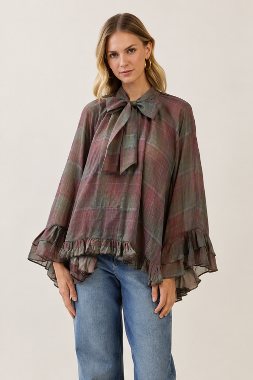 Model wearing TCEC burgundy plaid bow-tie ruffle blouse, front view